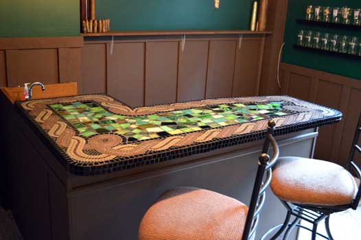Mosaic bar top in copper metallic glass tile and green stained glass